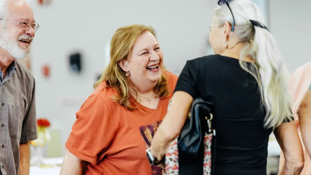 Friendly conversation between adults at Trinity’s JOY 55+ ministry event