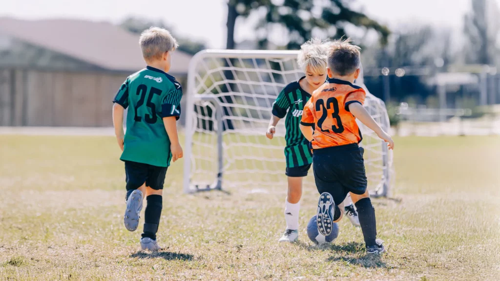 Young children playing soccer during Upward Soccer at Trinity Baptist Church.
