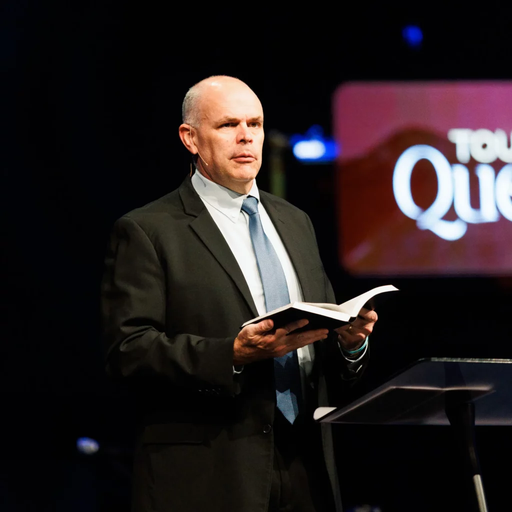 Dr. David Rose preaching at Trinity Baptist Church on faith and science.