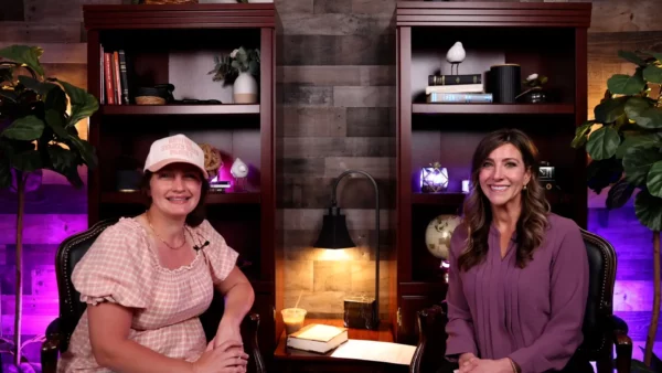 Hosts Katie James and Becky Girola smiling during a Christian parenting podcast recording.