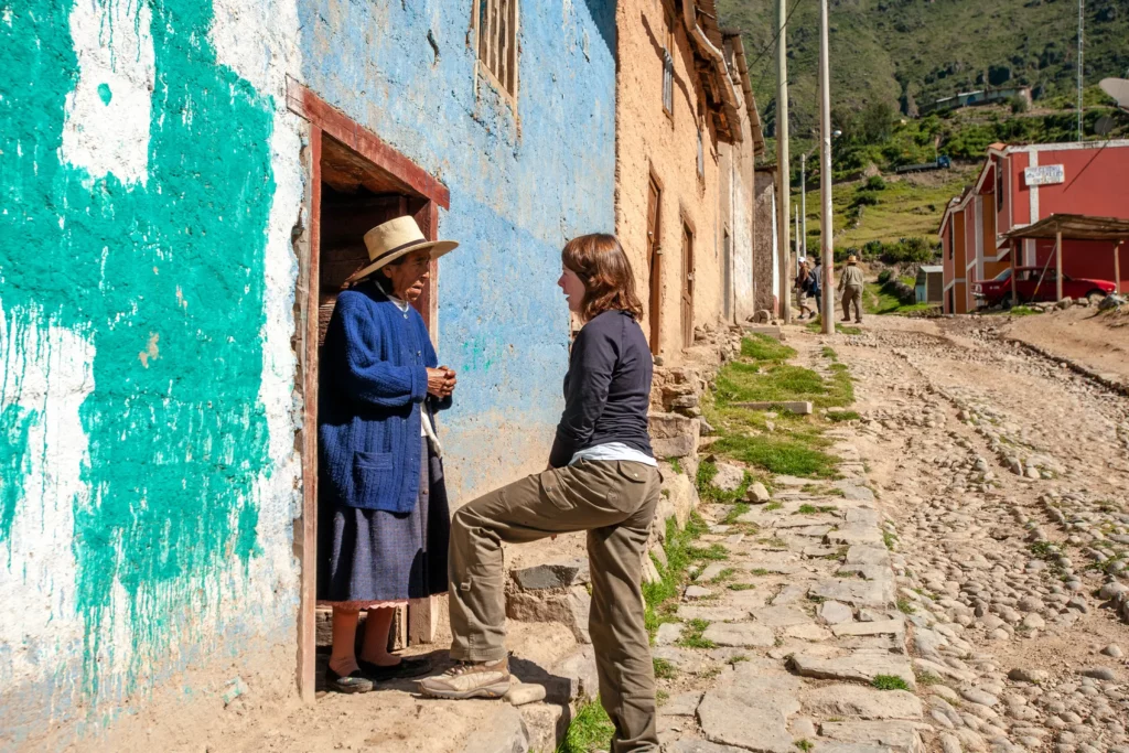 Mission team prays with a man on a street in Colombia