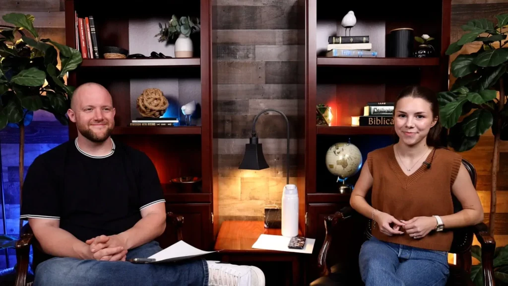 Podcast hosts seated in a studio discussing faith and social media.