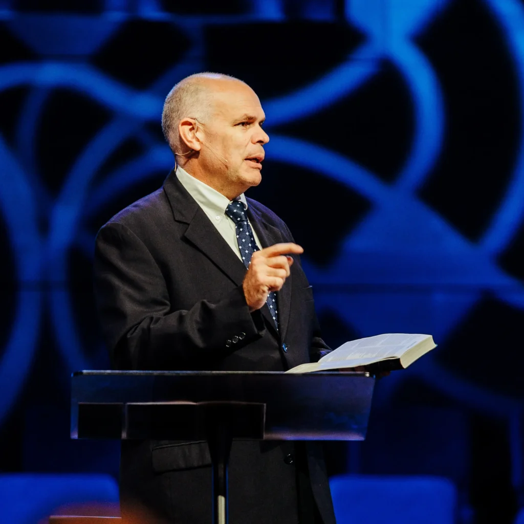 Dr. David Rose preaching at Trinity Baptist Church during "Hitting the Gym" sermon.