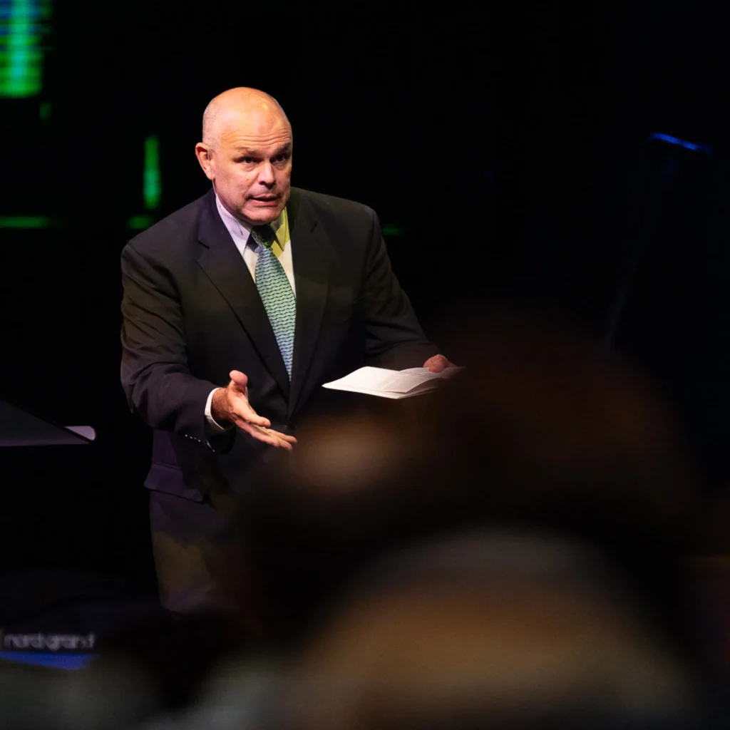 Pastor David Rose delivering the 'Attitude Adoption' message at Trinity Baptist Church.