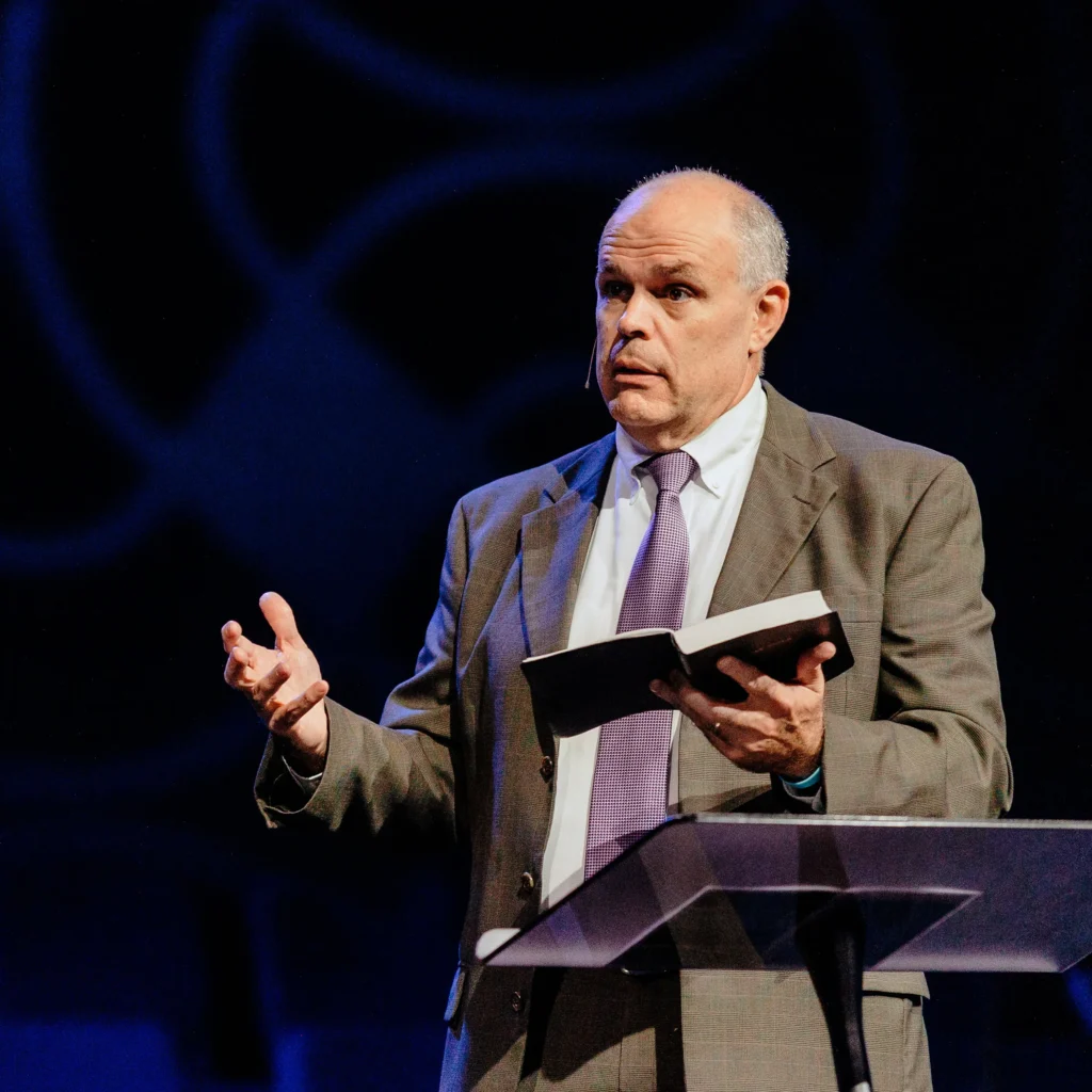 Pastor David Rose preaching from the Bible during Fellowship Haul sermon.