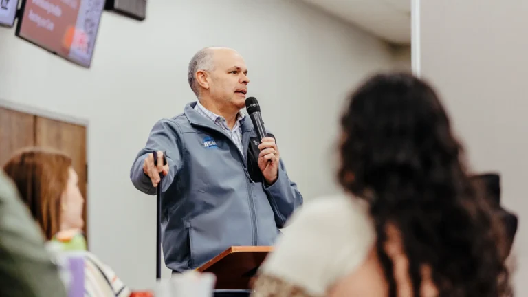 Pastor David Rose teaching Roots and Rocks class with attendees listening