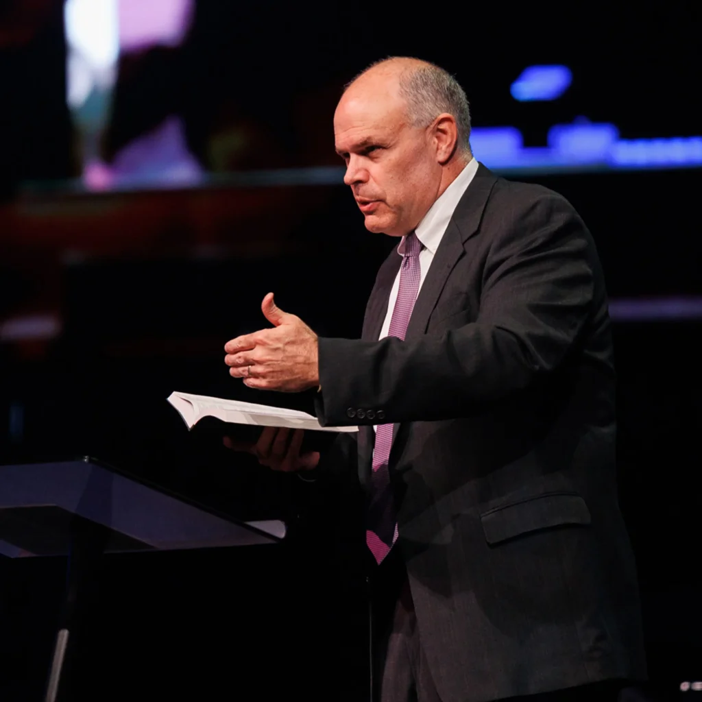 Pastor David Rose preaching about overcoming obstacles at Trinity Baptist Church.