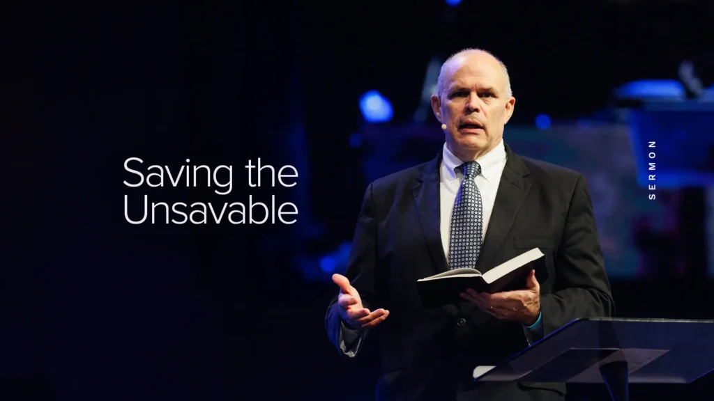 Pastor David Rose preaching 'Saving the Unsavable' sermon at Trinity Baptist Church, Bible in hand.