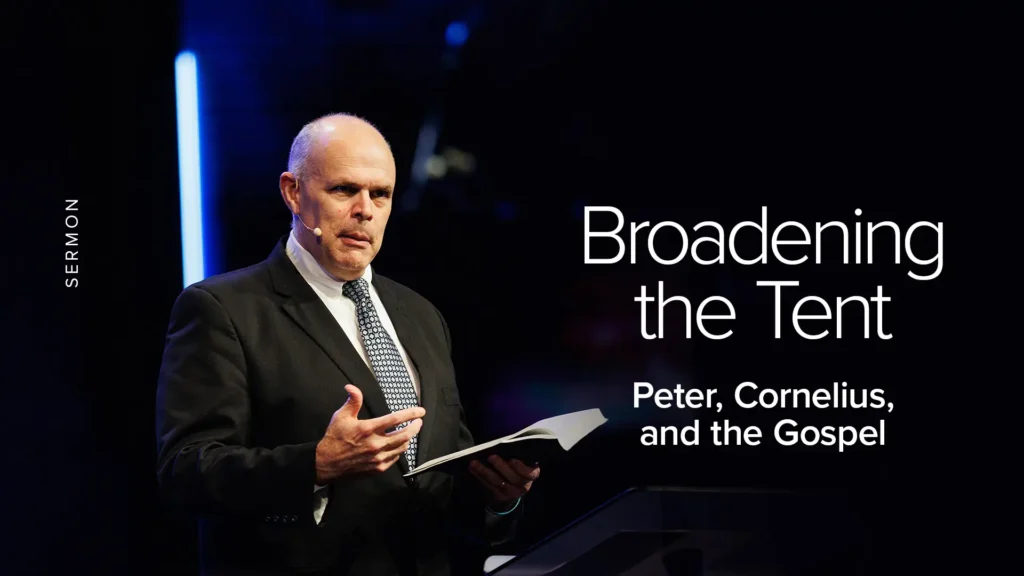 Pastor preaching at pulpit with open Bible — sermon: Broadening the Tent, Peter, Cornelius, and the Gospel