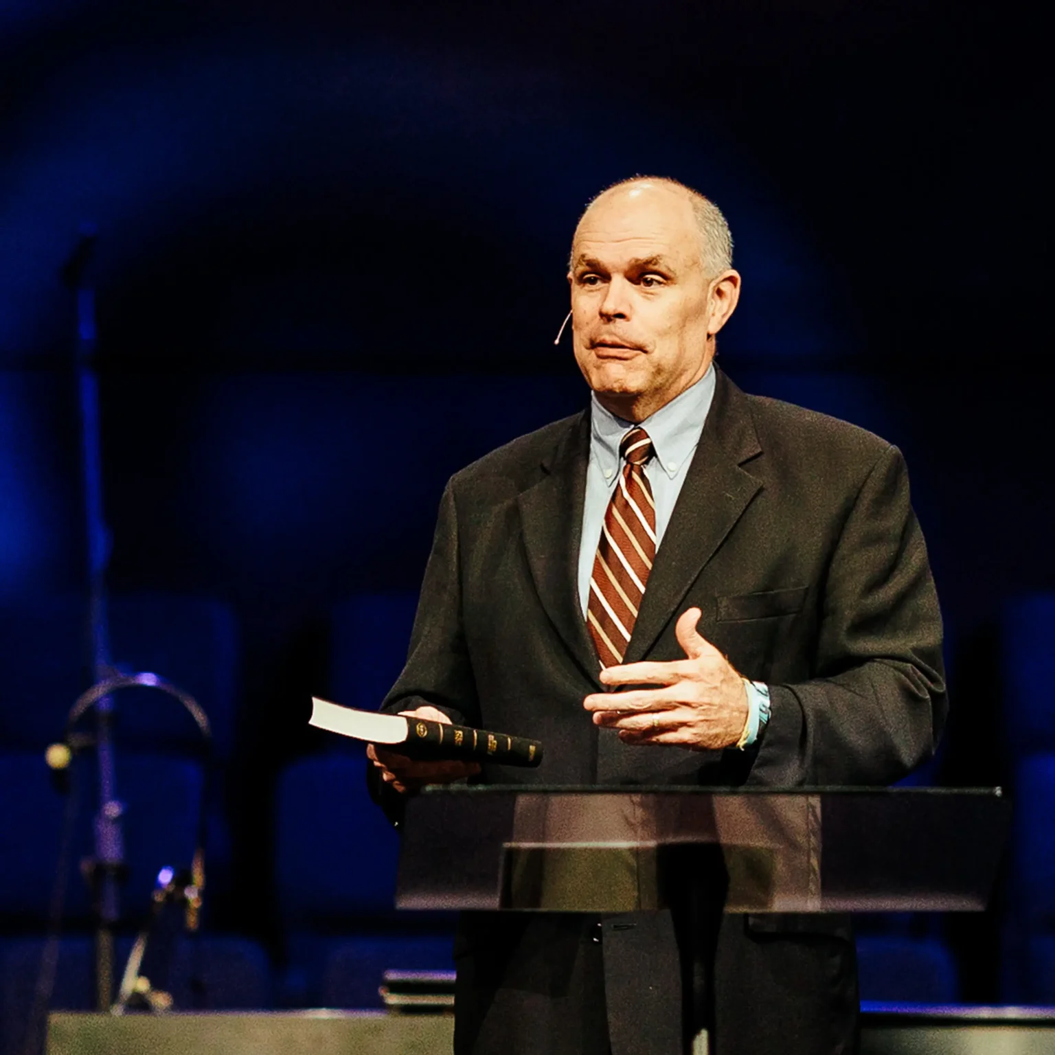 Pastor David Rose holds a Bible while preaching at Trinity Baptist Church — "Eat Your Wheaties" sermon series.