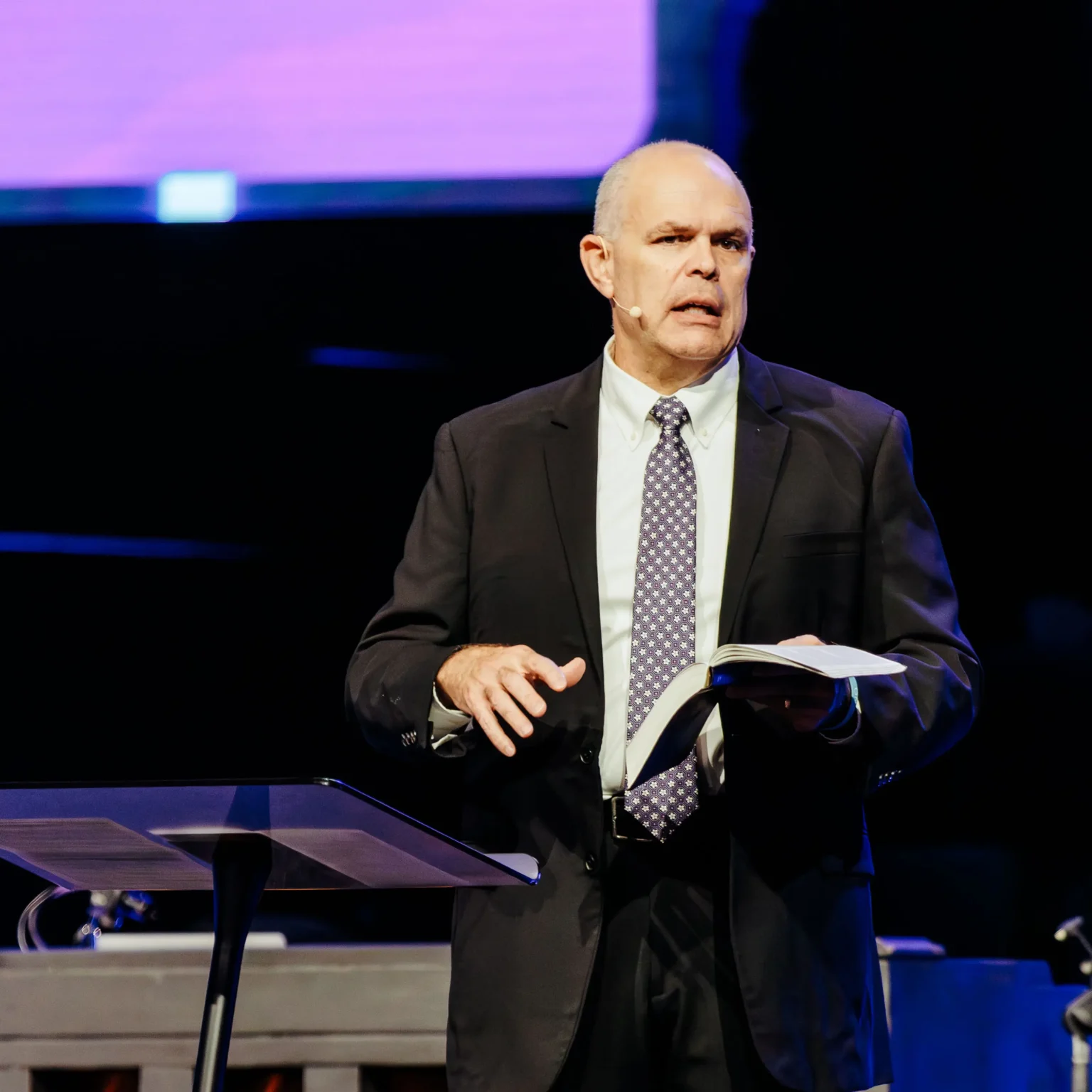 Pastor David Rose preaching from an open Bible at Trinity Baptist Church — Family Planning sermon